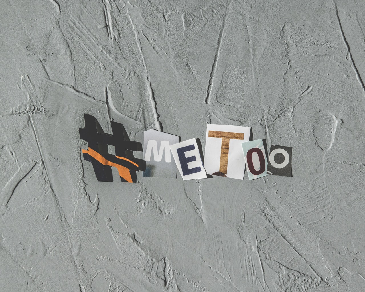 Letters cut from magazine headlines spell out "#MeToo"