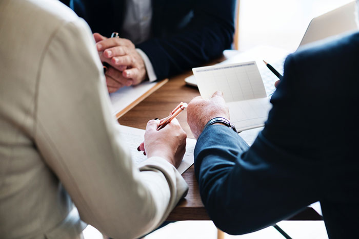 Couple signs tax documents 